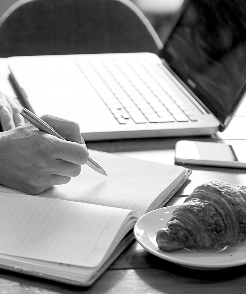 Taking notes at a table in a cafe